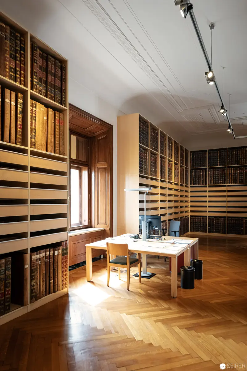 Illuminated Scholarly Archive: Herringbone Floors and Antique Book Collection