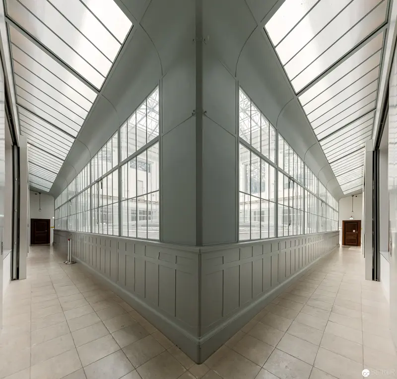 Architectural Interior with Angular Glass and Light Convergence