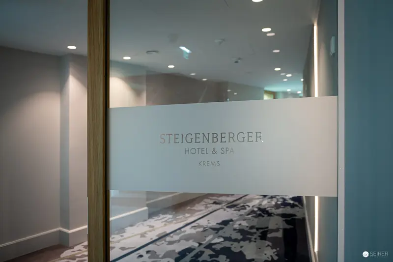 Steigerberger Hotel & Spa Interior: Frosted Glass Signage and Contemporary Design