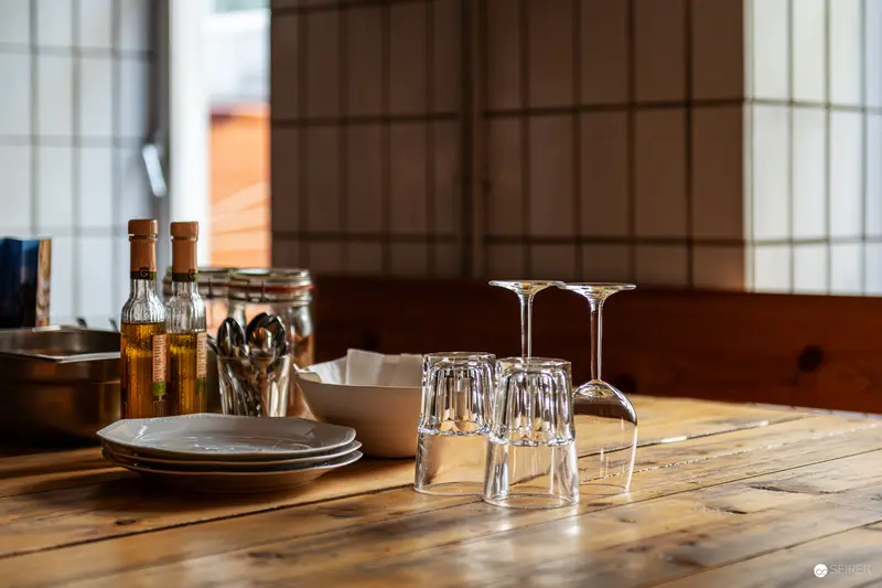 Rustic Tabletop Arrangement with Glasses and Bottles at Gegenbauer Venue in Vienna
