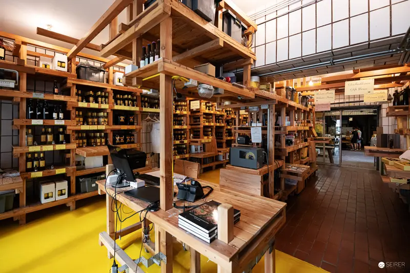 Wooden Shelves and Wine Bottles at Gegenbauer Vinegar and Oil Shop in Vienna