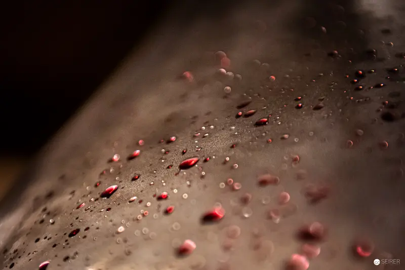 Abstract Macro Droplet Study with Red and Beige Chromatic Variation