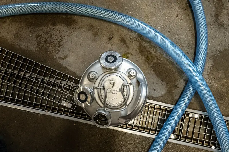 Brewery Equipment Detail with Blue Hose at 100 Biere Private Brewery in Vienna