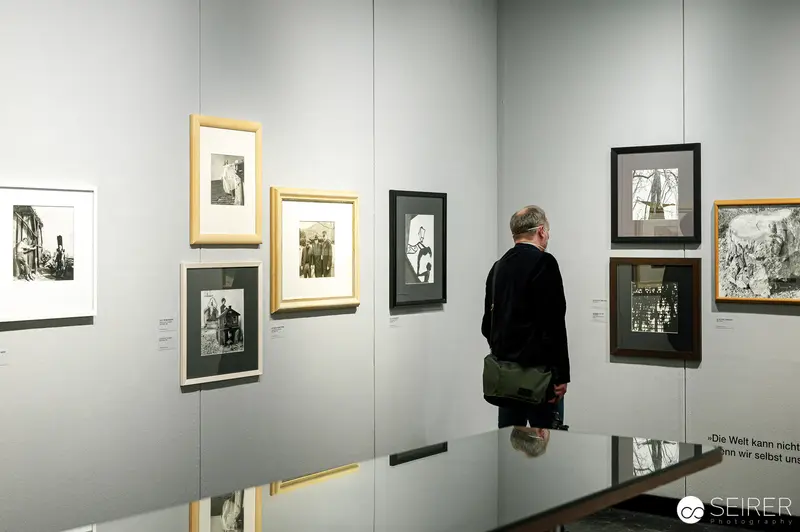 Visitor Contemplating Padhi Frieberger's Photographic Retrospective at Westlicht Gallery