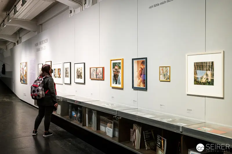 Visitor Explores Padhi Frieberger Photographic Exhibition at WestLicht Gallery, Vienna