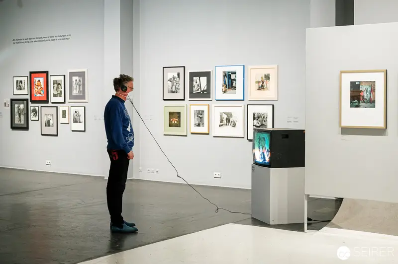 Visitor Contemplates Padhi Frieberger Photographic Exhibition at WestLicht, Vienna