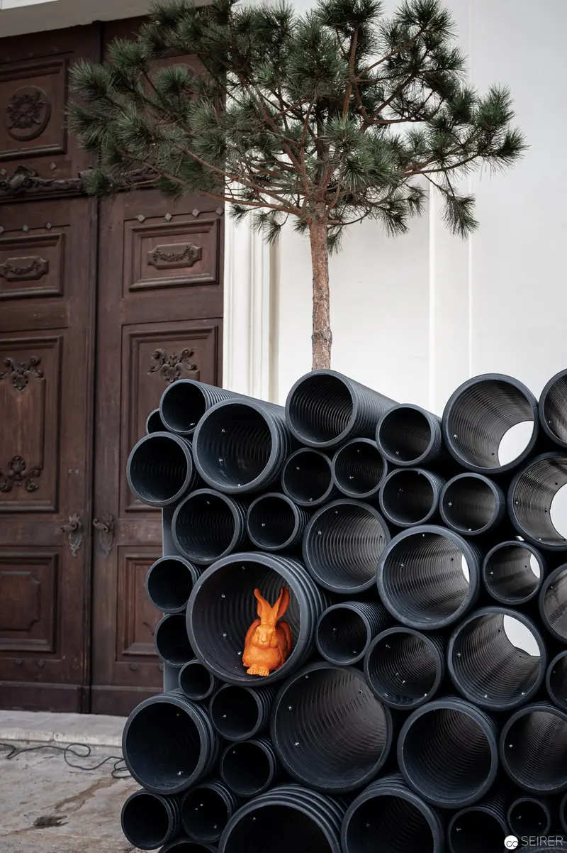 Sculptural Installation of Black Pipes with Unexpected Flame Illumination