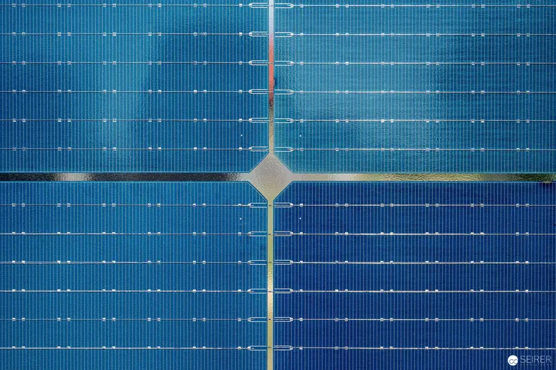 Detailed Blue Solar Panel Grid with Geometric Central Junction