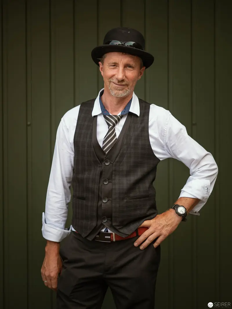 Mature Male Model in Vintage Vest and Hat at Studio Photoshoot