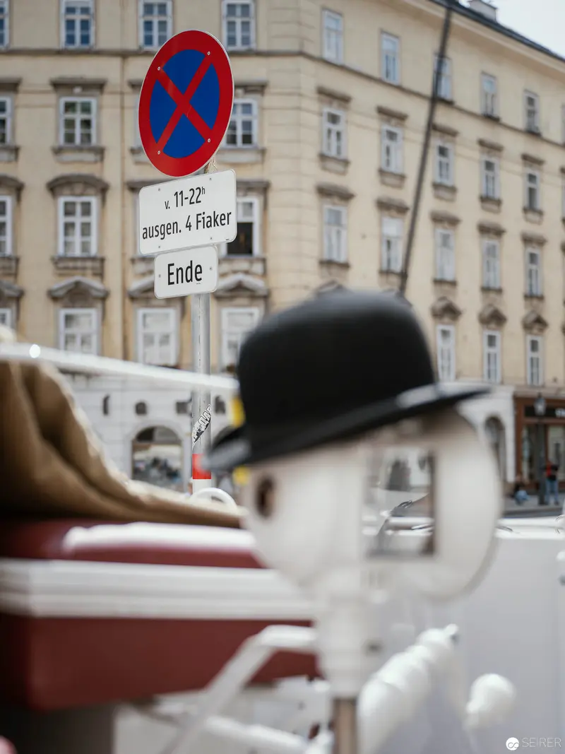 No Stopping: Urban Traffic Sign with Vintage Hat and Architectural Background
