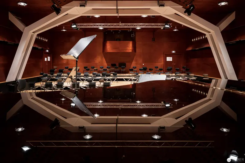 Konzerthaus Wien: Geometric Concert Hall Interior with Stage Lighting