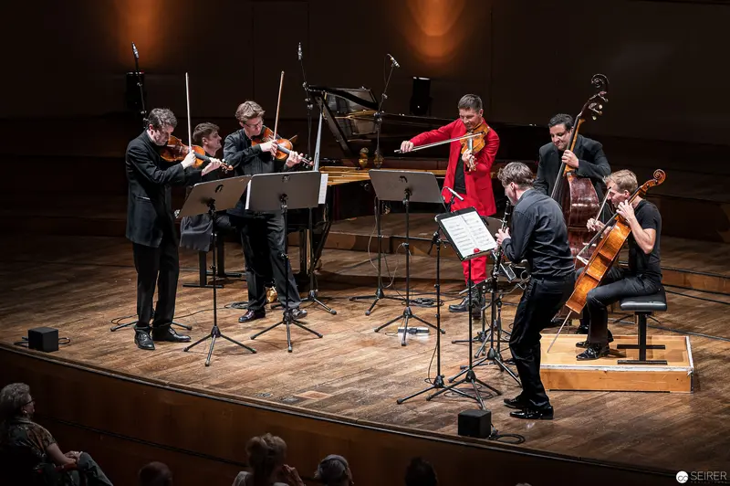 Chamber Music Ensemble Performance at Konzerthaus Wien with Soloist in Red Jacket