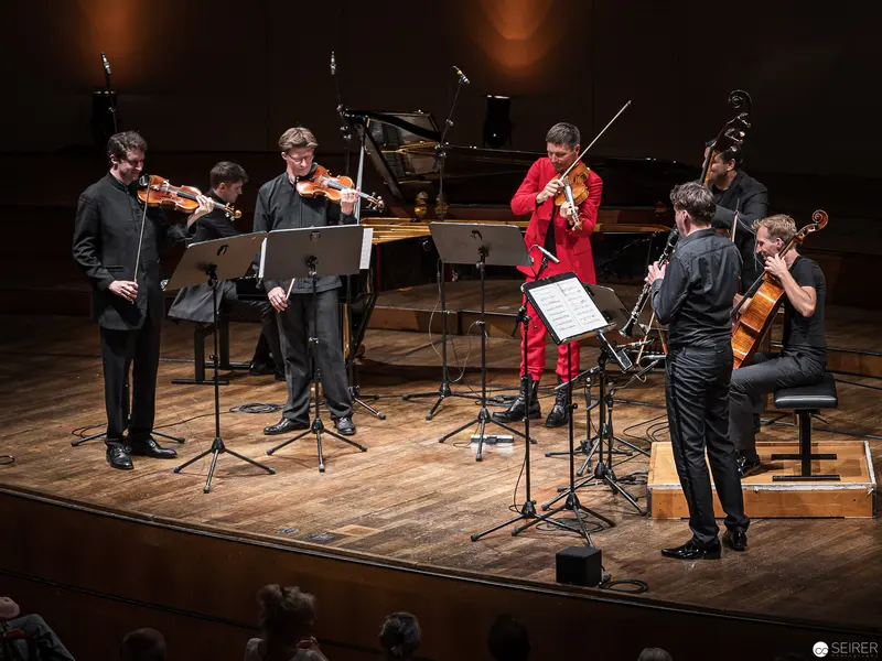 Chamber Music Ensemble Performance at Konzerthaus Wien in Vibrant Attire