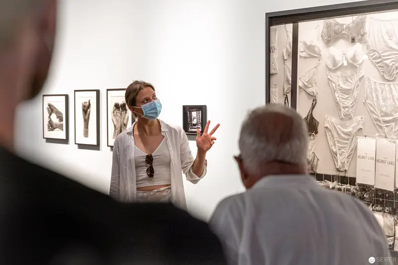 Elfie Semotan Exhibition View: Curator Discussing Photographic Works at Kunsthaus Wien
