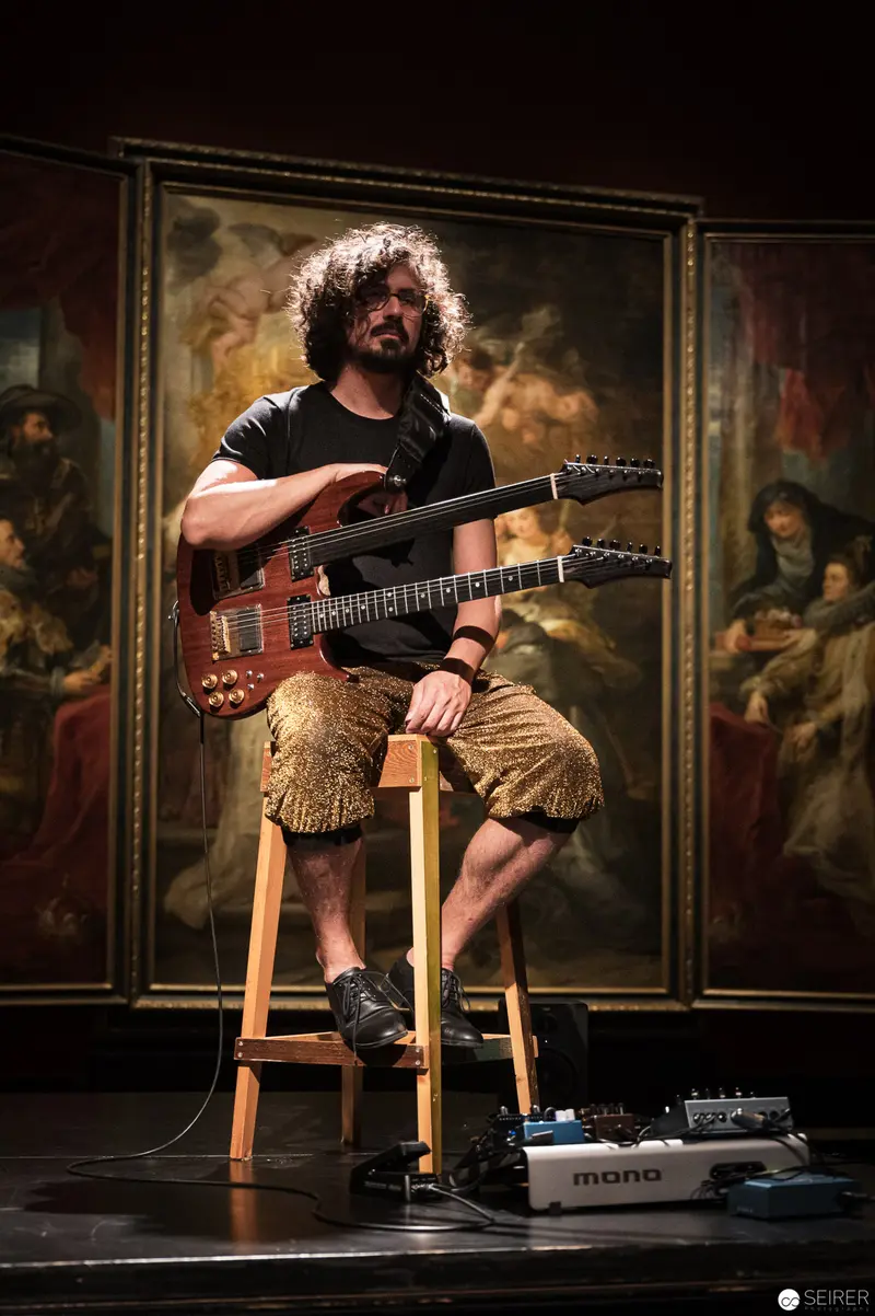 Guitarist in Contemplative Pose at Kunsthistorisches Museum Performance Ganymed