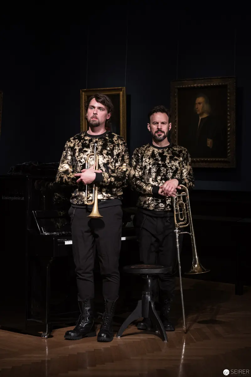 Brass Musicians in Ornate Matching Attire at Kunsthistorisches Museum Wien