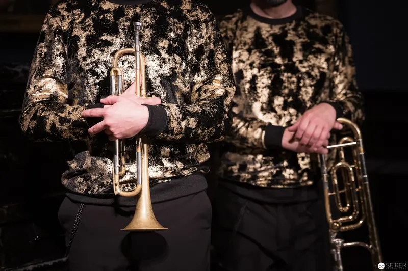 Brass Musicians in Metallic Jackets Performing at Kunsthistorisches Museum Wien