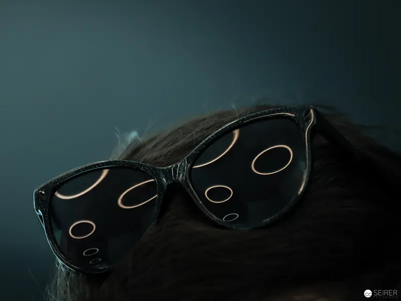 Vintage Eyeglasses with Luminous Reflections on Dark Background