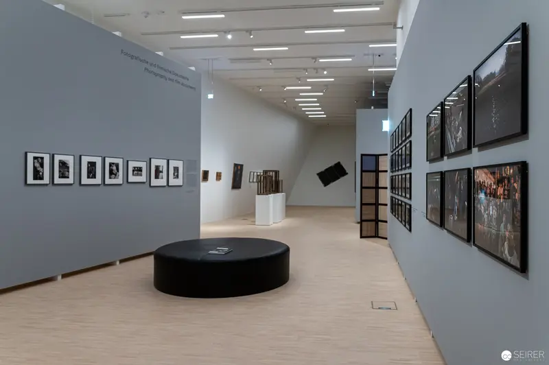 Landesgalerie Niederösterreich Exhibition View: Photographic Display and Black Circular Seating