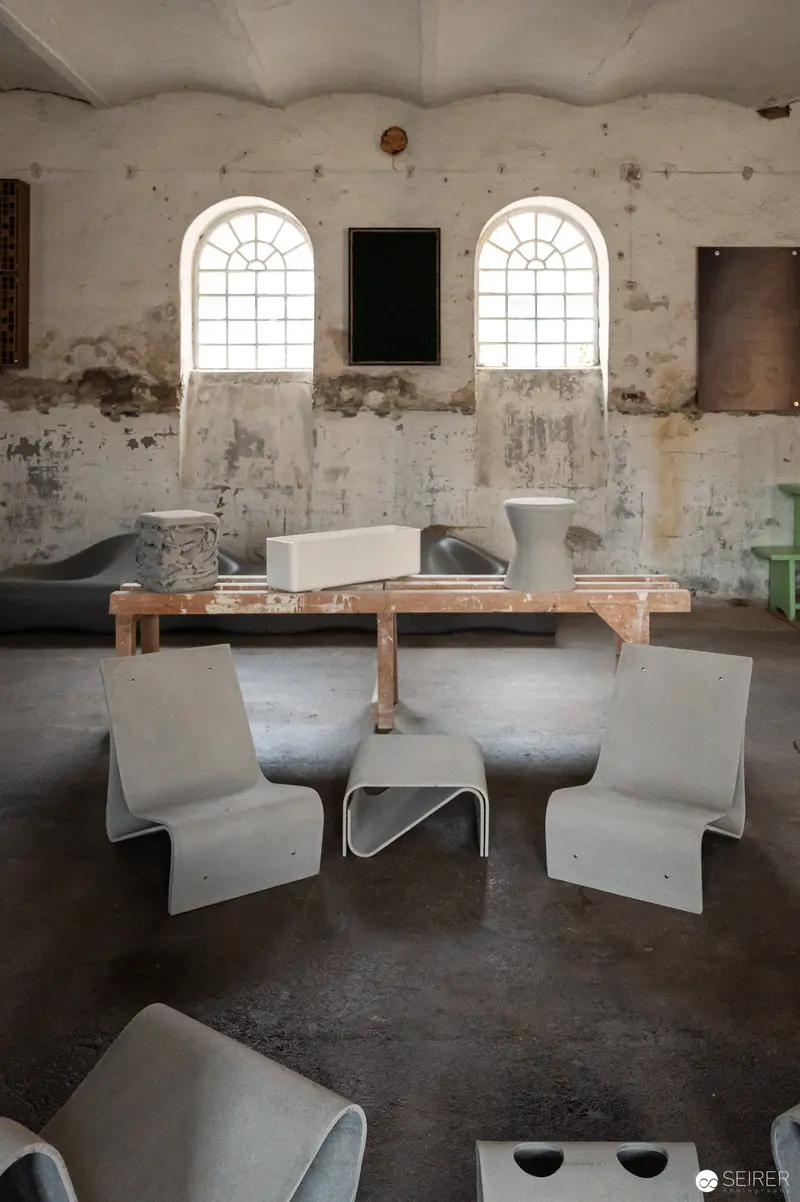 Modernist Interior with Sculptural Chairs in Minimalist Industrial Space