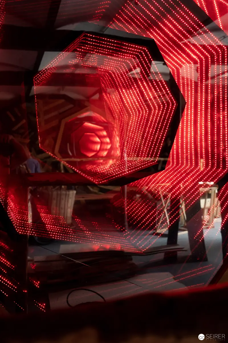 Luminous Red Geometric Light Installation in Architectural Space