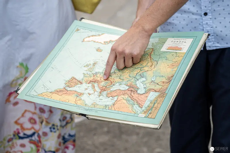 Hand Pointing at European Topographical Map During Guided Tour in Vienna