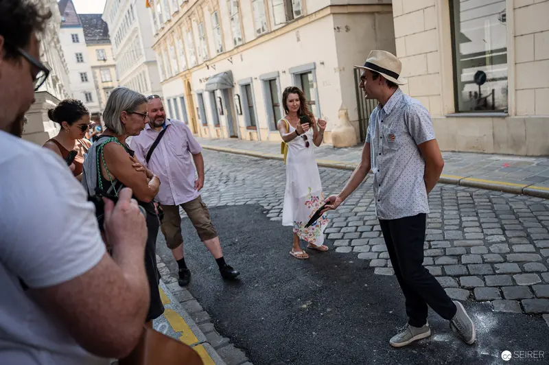 Casual Street Scene with Tourists and Locals in Historic European City