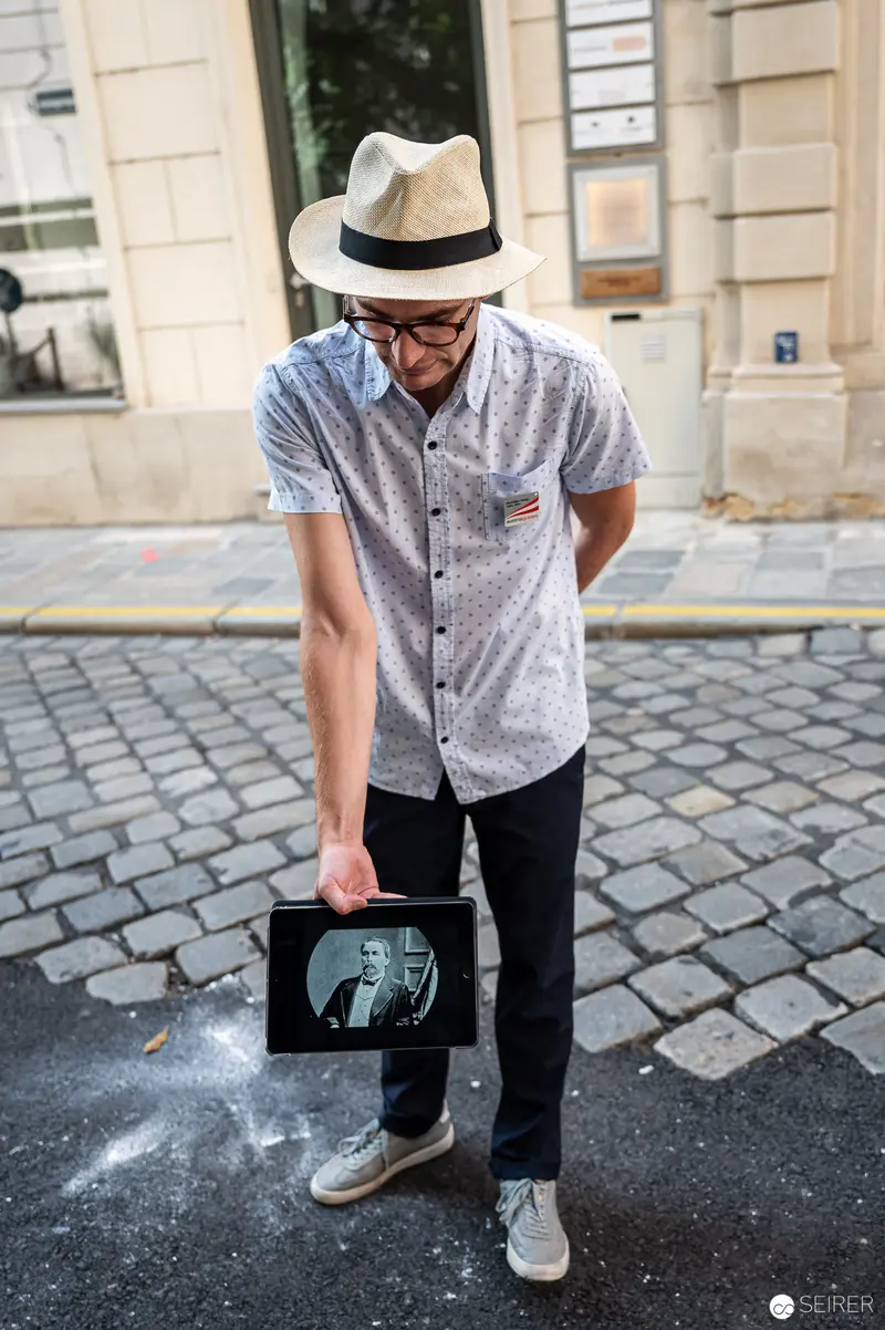 Urban Self-Reflection: Framed Perspective on Cobblestone Street