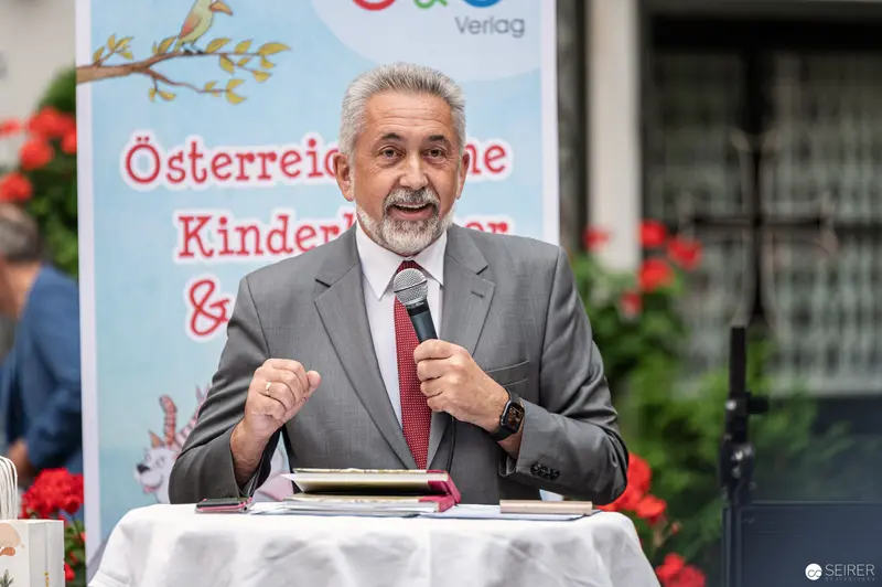 Austrian Literature Event: Speaker Delivers Passionate Address at Podium