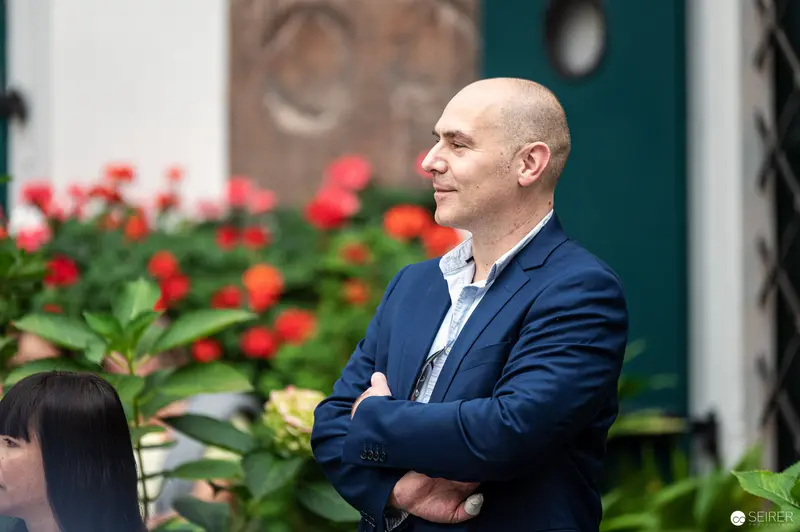 Author in Navy Blazer at Book Reading Event in Deutschordenshaus, Vienna