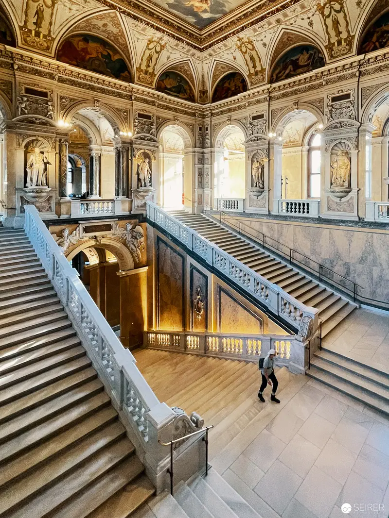 Grand Staircase of Vienna's Natural History Museum with Elegant Architectural Ornamentation