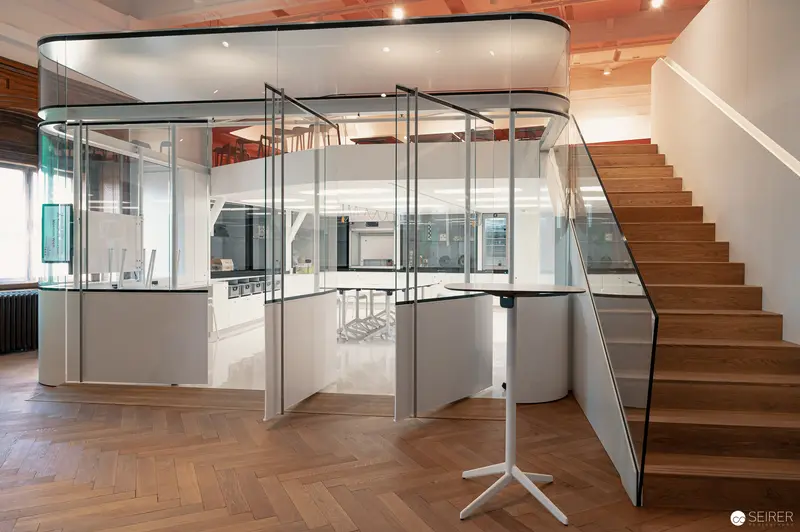 Modern Glass Office Interior with Wooden Staircase and Minimalist Design