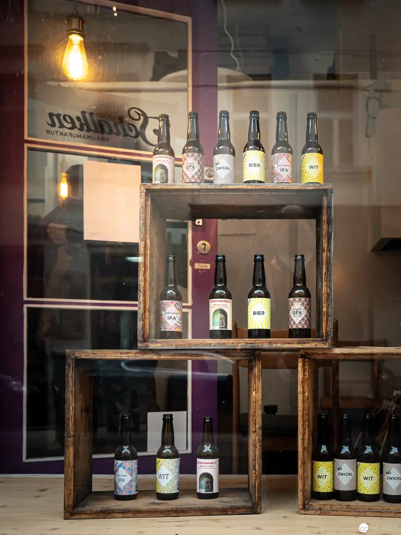 Artisan Brewery Display: Vintage Wooden Shelves with Craft Beer Bottles