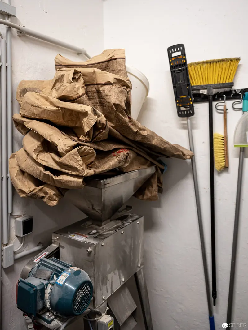 Cluttered Storage Corner with Cleaning Tools and Industrial Equipment