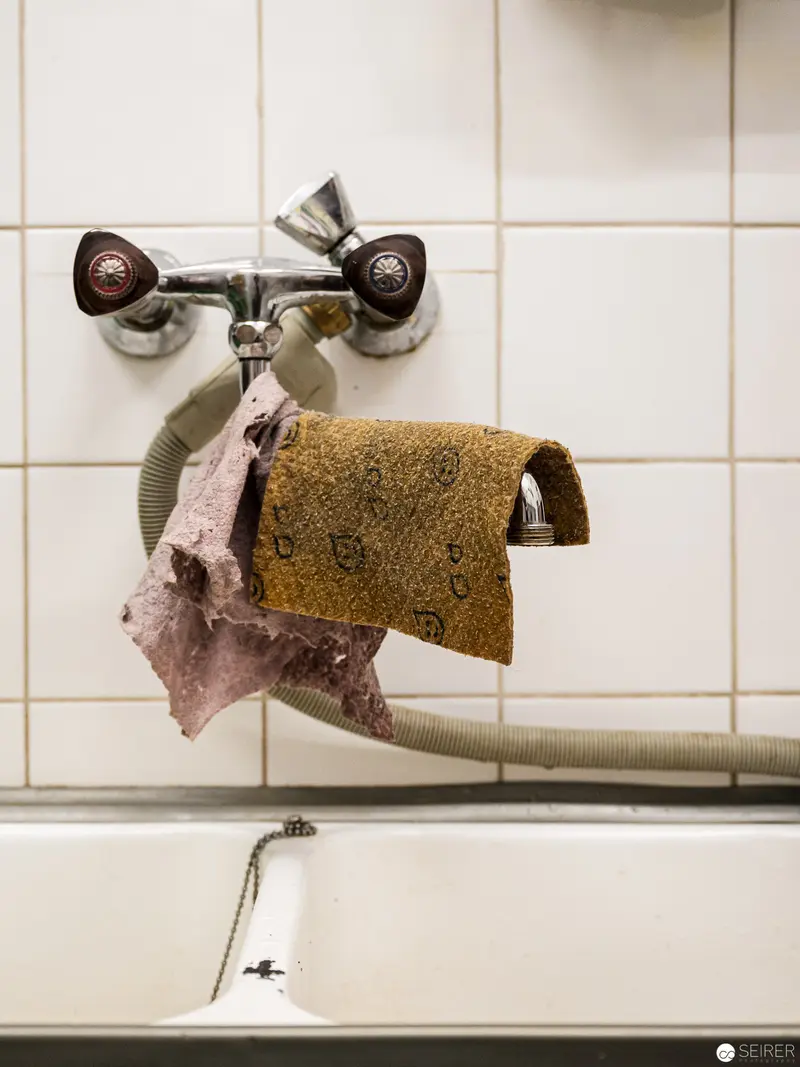 Intimate Bathroom Fixture Study with Towels and Vintage Plumbing