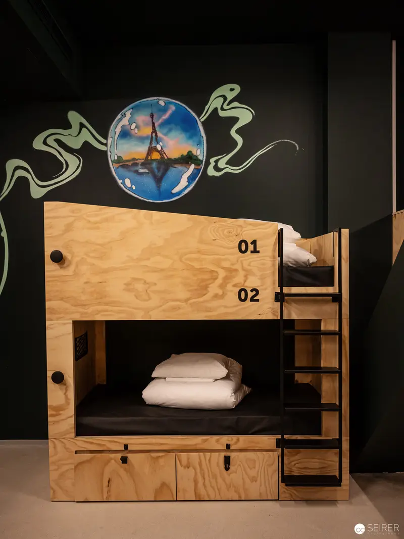 Modern Bunk Bed Design with Global Imagery at Jo & Joe Hotel Westbahnhof Wien