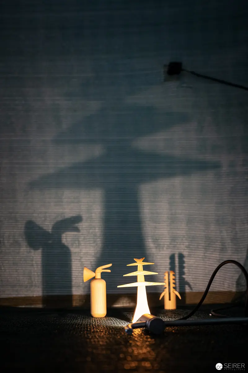Shadow Play of Design Objects with Candlelight and Intricate Silhouettes