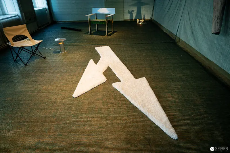 Geometric White Form Positioned on Textured Floor During Vienna Design Week