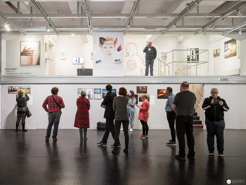 World Press Photo Exhibition Visitors Exploring Art Gallery Space at Westlicht