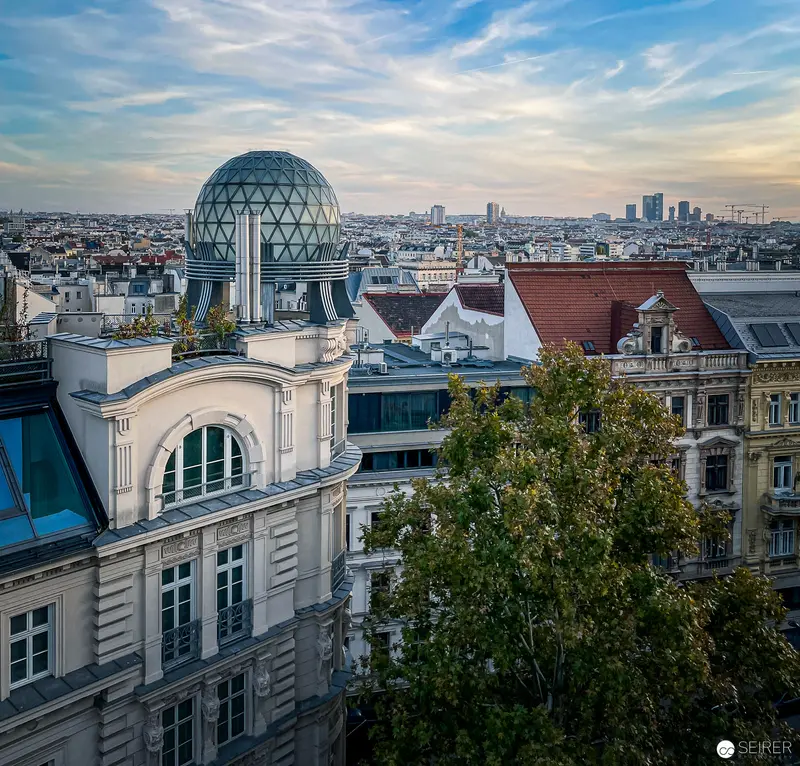 Panoramic View of Vienna Rooftops with Unique Spherical Glass Dome Architecture
