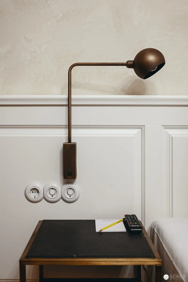 Minimalist Desk Lamp and Workspace in Monochromatic Interior Setting