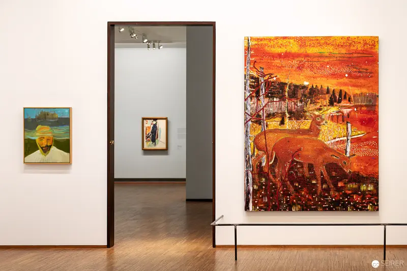 Munch Gallery Installation with Vibrant Orange-Red Landscape Painting