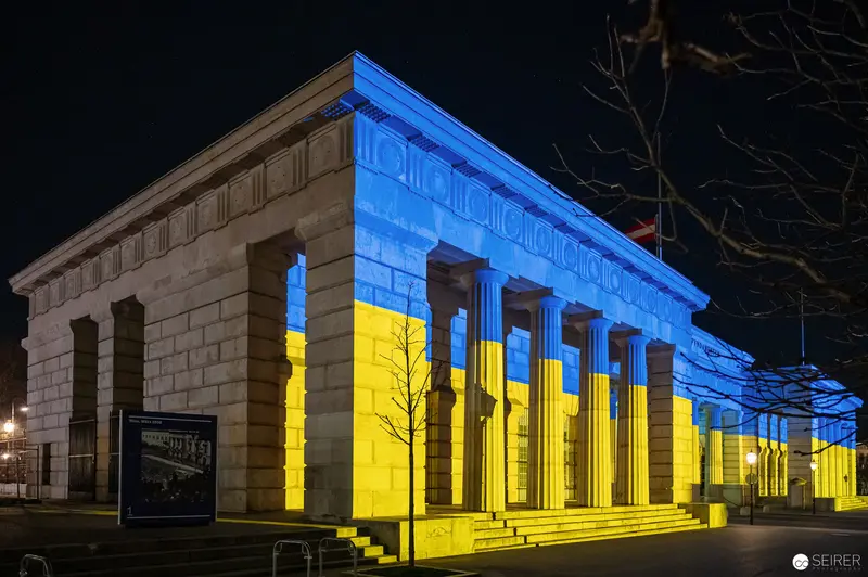 Neoclassical Building Illuminated in Blue and Yellow of Ukrainian Flag at Night