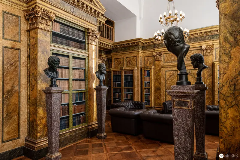 Neoclassical Library Interior with Bronze Busts on Granite Pedestals