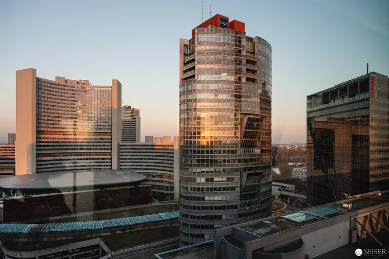 Modern Urban Skyline with Glass and Steel High-Rise Architecture at Sunset