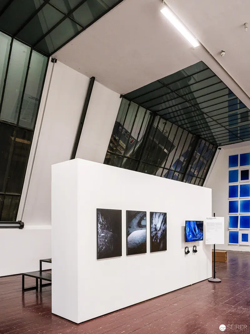 FOTO WIEN 2022 Exhibition View: White Gallery Wall with Blue-Toned Photographic Prints