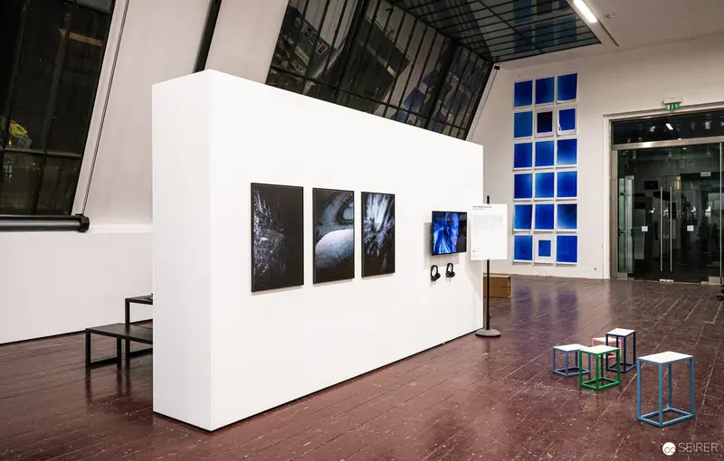 FOTO WIEN 2022 Exhibition View: White Gallery Wall with Photographic Installations