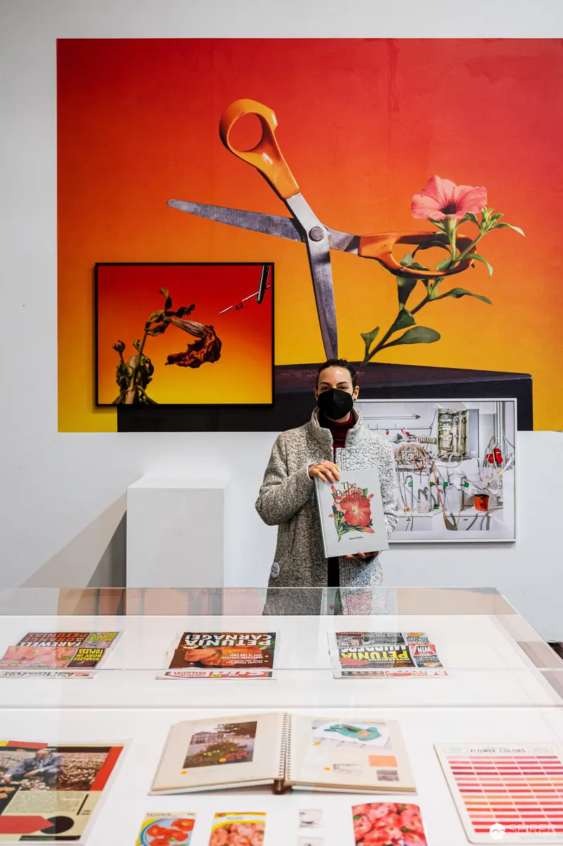 Curator at FOTO WIEN 2022 Exhibition Surrounded by Graphic Design and Scissors Motif
