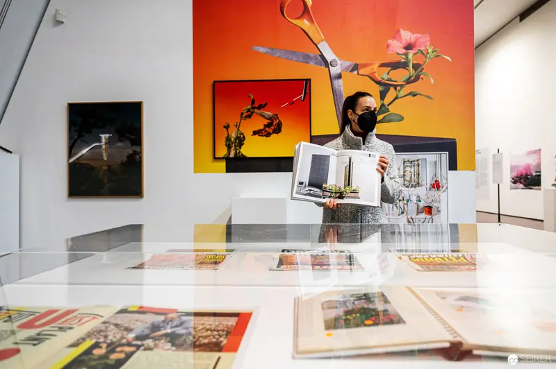 Exhibition View of FOTO WIEN 2022: Curator with Mask Among Art Installations
