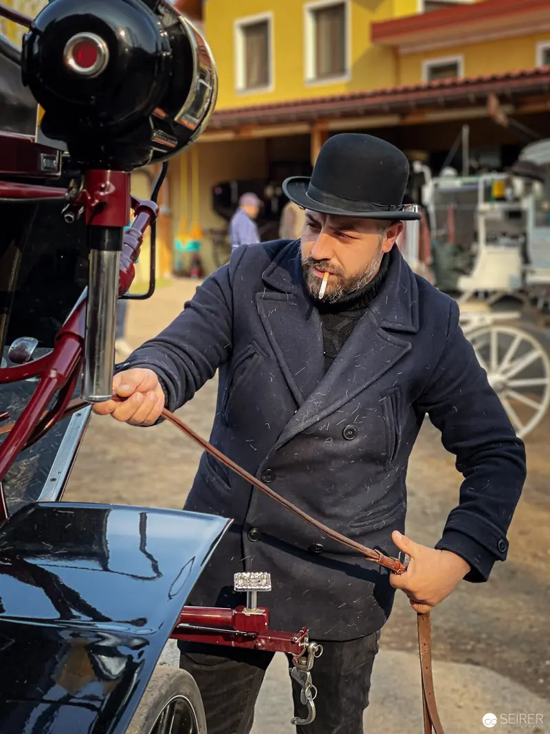 Vienna Fiaker Preparing Carriage in Traditional Attire and Bowler Hat